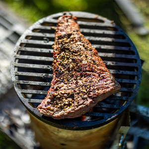 Steak on cast iron bbq grill 