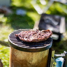 Load image into Gallery viewer, Cast iron grill on charcoal chimney