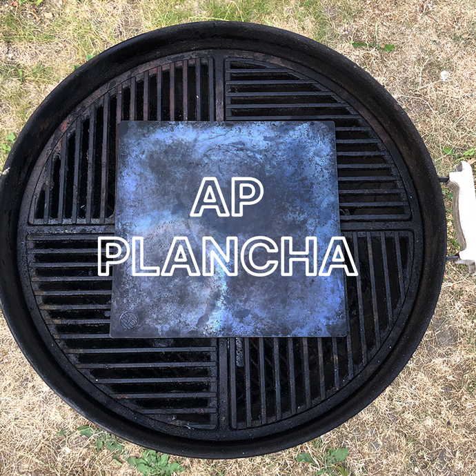 Overhead shot of the AP Plancha cooking steel on a weber barbecue with text overlay